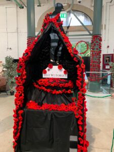 Market Hall - the unknow soldier statue decorated with crocheted and knitted poppies